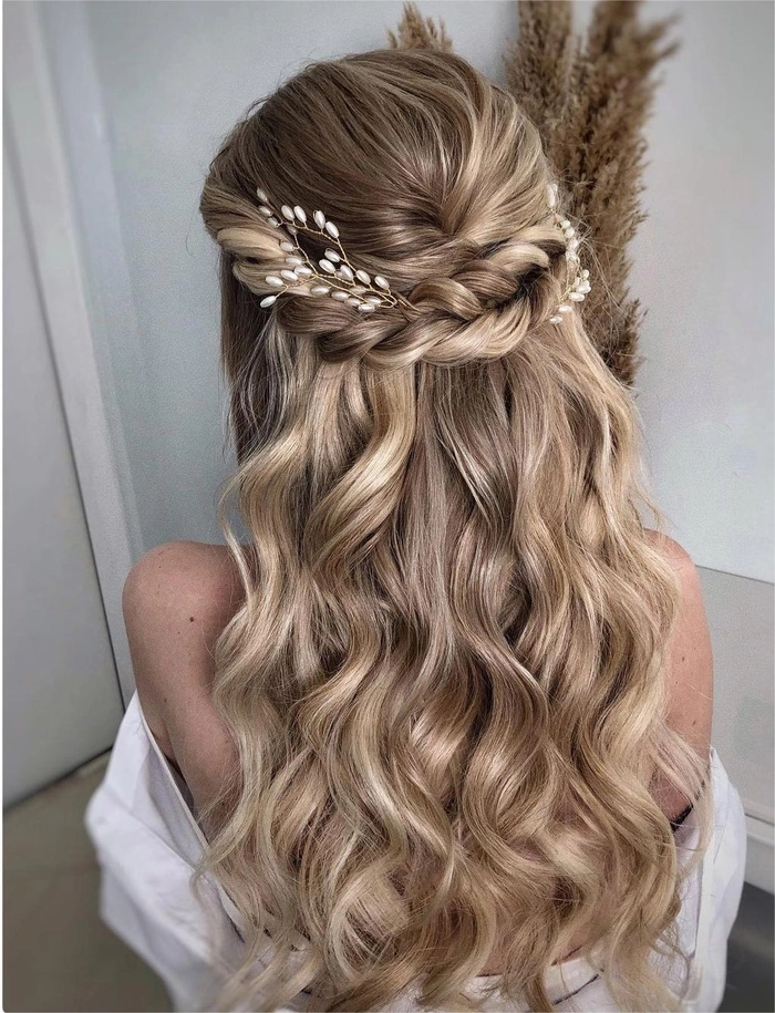 Beautiful wedding hairstyle showcasing a cascading waterfall braid for brides Elegant waterfall braid wedding hair styled with delicate floral accessories