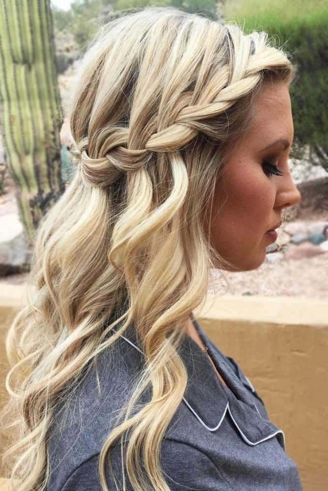 Beautiful waterfall braid wedding hairstyle perfect for brides and bridesmaids Bride with an elegant waterfall braid wedding hair styled for a special day
