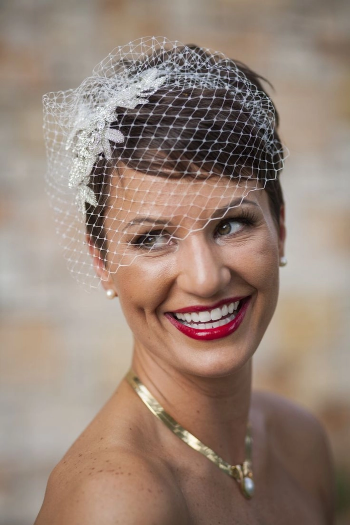 Elegant wedding hairstyle featuring a classic birdcage veil for a timeless bridal look