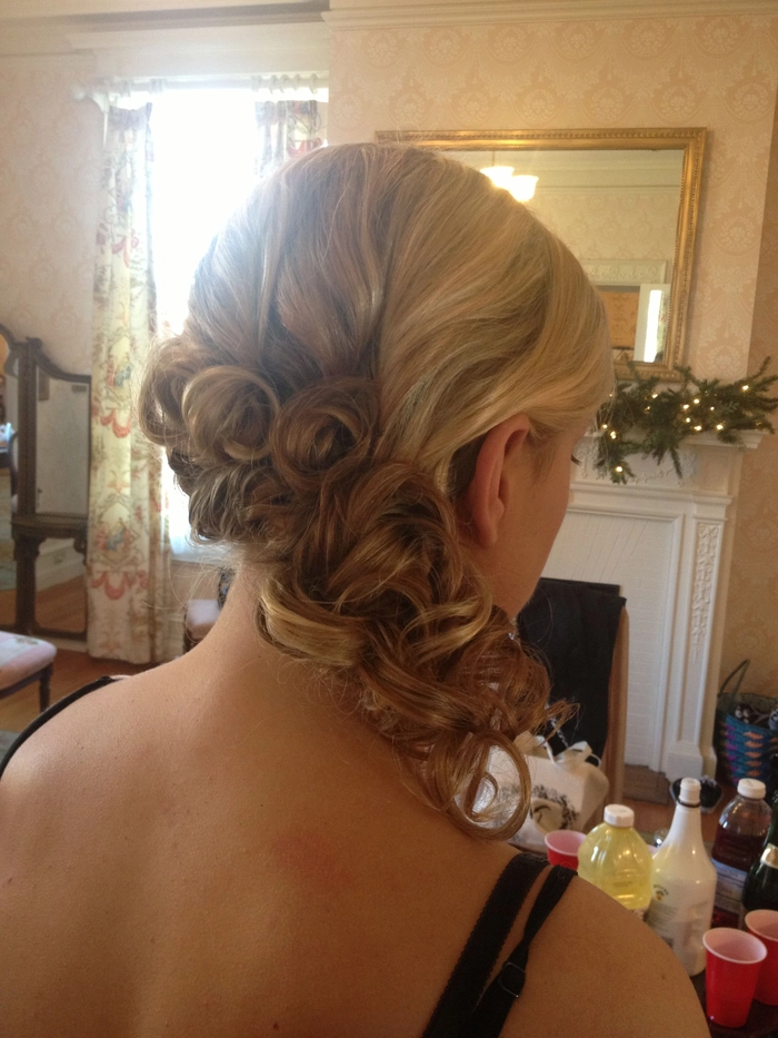 Chic and romantic wedding hair for a stunning backless bridal gown Elegant wedding hairstyle showcasing intricate braids for a backless dress