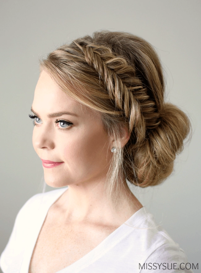 Beautiful fishtail braid wedding hairstyle perfect for a romantic ceremony Elegant wedding hair fishtail braid updo with soft curls and intricate styling