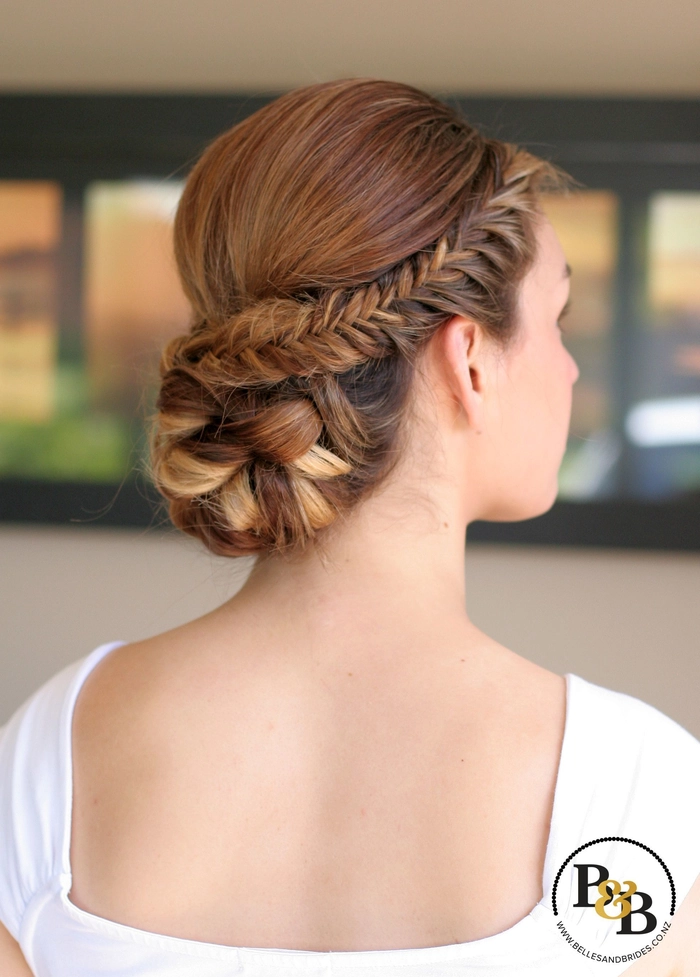 Beautiful fishtail braided updo hairstyle perfect for weddings Elegant wedding hair fishtail braid updo with soft curls