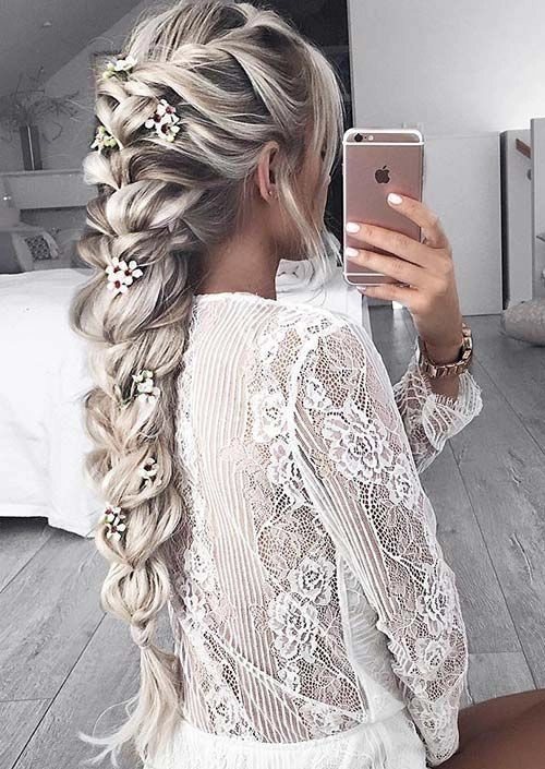 Beautiful fishtail braid updo perfect for wedding hairstyles Elegant wedding hair fishtail braid updo styled for a bride