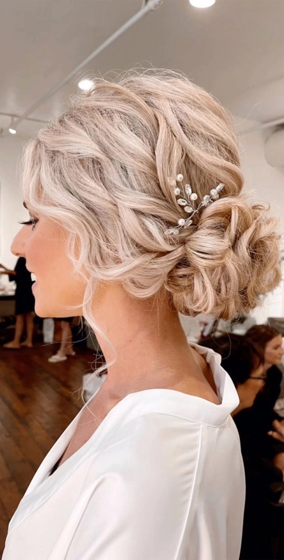 Elegant wedding hair styled for blonde balayage highlights
