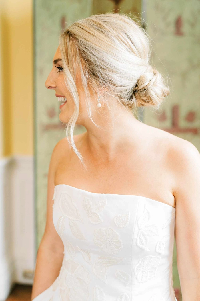 Beautiful bridal hairstyle perfect for showcasing a strapless wedding gown on your special day Elegant wedding hair styled to complement a strapless dress, featuring soft curls and delicate accessories