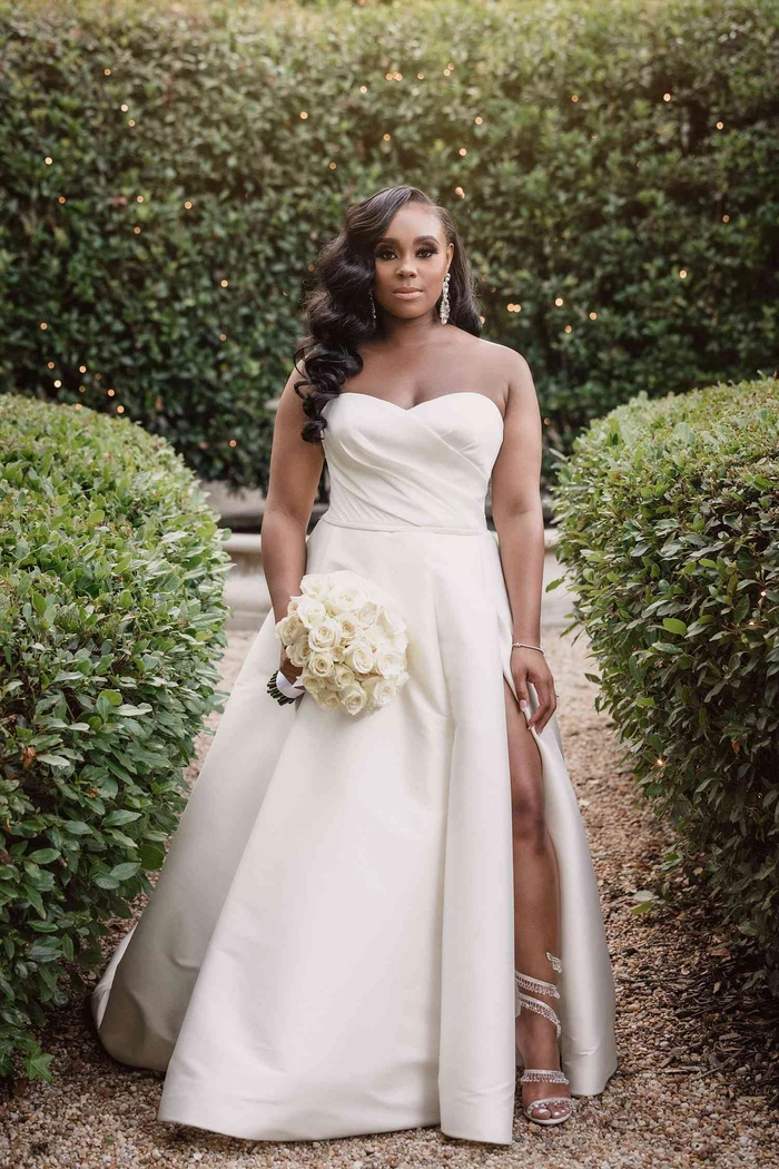 Wedding Hairstyles Inspiration Image 9 showcasing perfect hair for strapless gowns Elegant wedding hair styled for a strapless dress with soft curls and volume