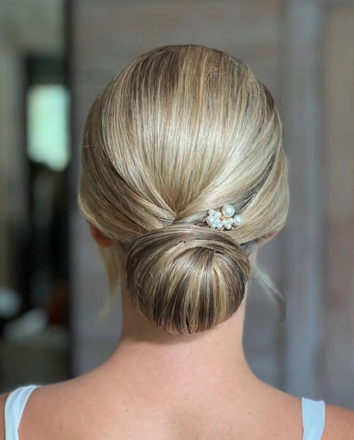 Sophisticated wedding hairstyles for women celebrating their special day at any age Elegant wedding hairstyle for older brides with soft curls and floral accents