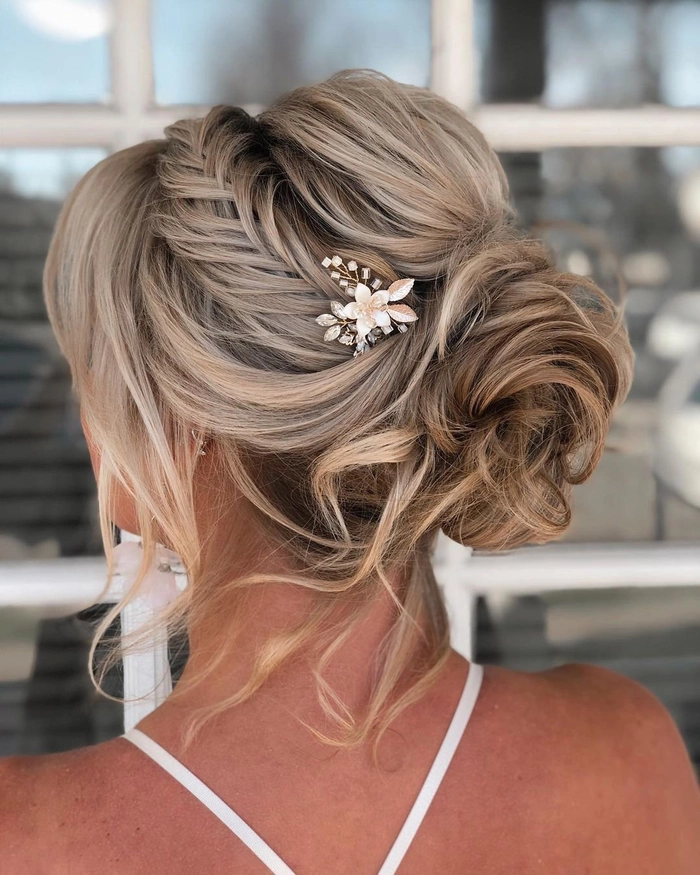 Elegant wedding hairstyle for short layered hair with soft waves and floral accessories