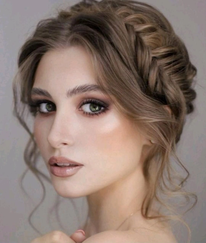 Elegant wedding hairstyle featuring soft bangs and delicate curls