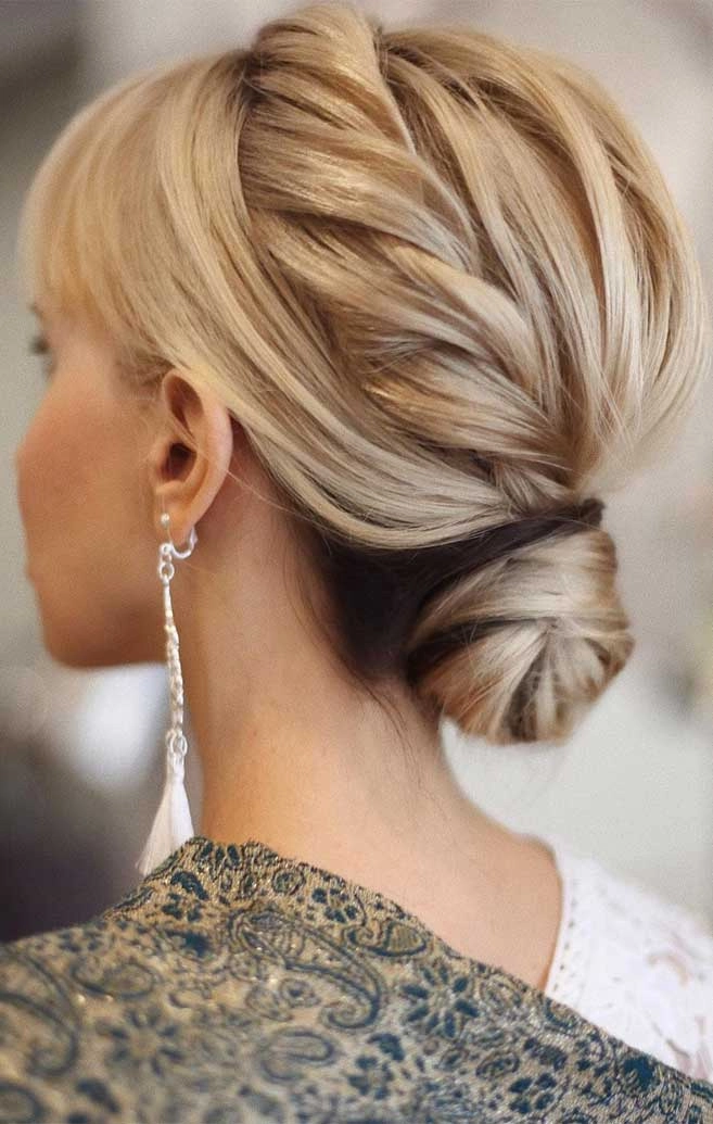 Chic and timeless wedding hairstyle inspiration for mature brides in their 50s and beyond Elegant wedding hairstyle for older brides with soft curls and subtle highlights