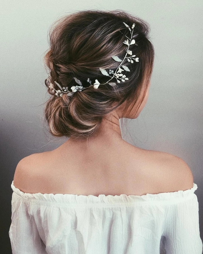 Beautiful bridal hair idea perfect for a strapless wedding gown look Elegant wedding hairstyle for strapless dress with soft curls and floral accents