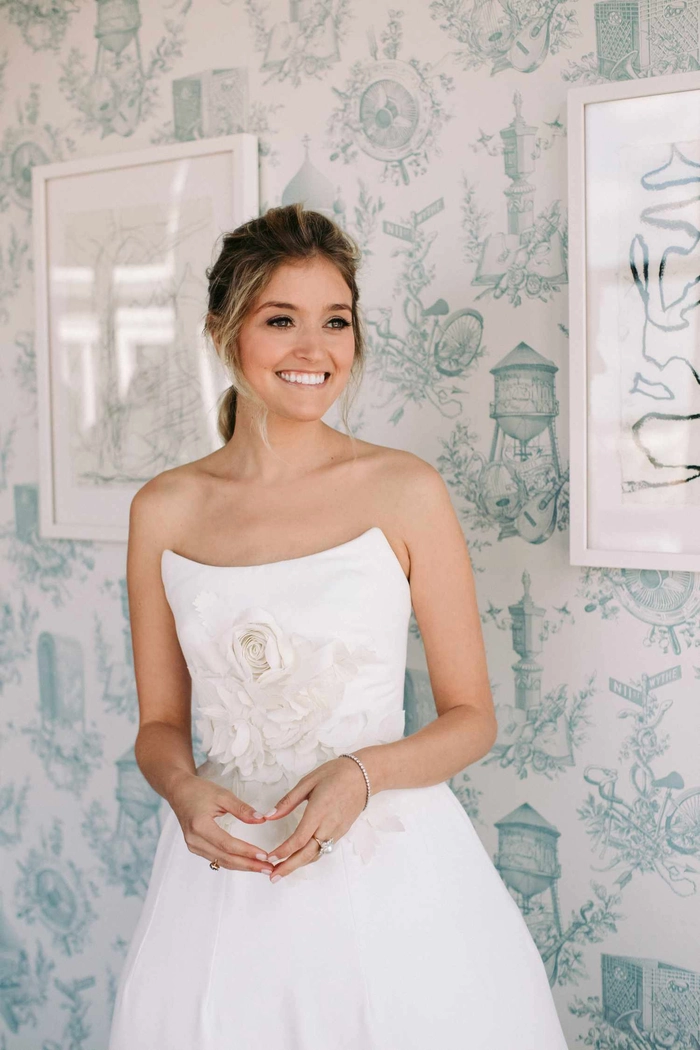 Romantic wedding hair ideas perfect for strapless gowns in soft, flowing styles Elegant wedding hairstyle complementing a strapless dress with soft curls
