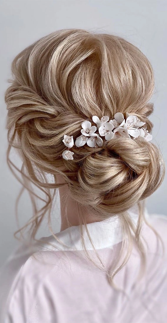 Beautiful twisted low bun wedding hairstyle showcasing intricate detailing Elegant wedding hair styled in a twisted low bun perfect for brides
