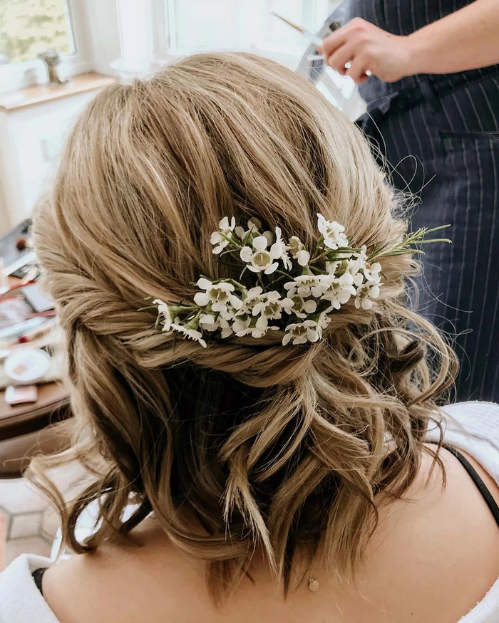 Elegant wedding hair styled for short layered cuts with soft curls and delicate accessories