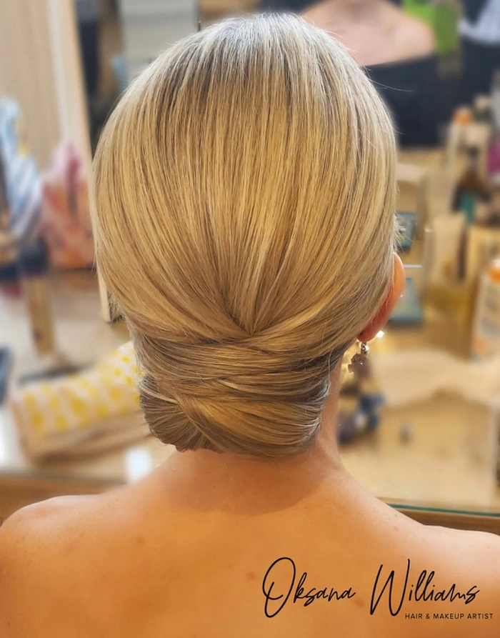 Classic wedding hairstyles featuring a beautiful twisted low bun hairstyle Elegant wedding hair twisted low bun with soft curls