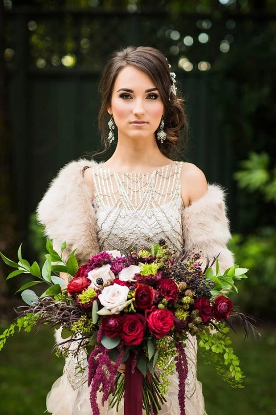 Elegant winter wedding hairstyle featuring delicate faux fur accessories