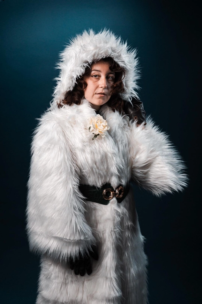 Elegant winter wedding hairstyle adorned with luxurious faux fur accessories