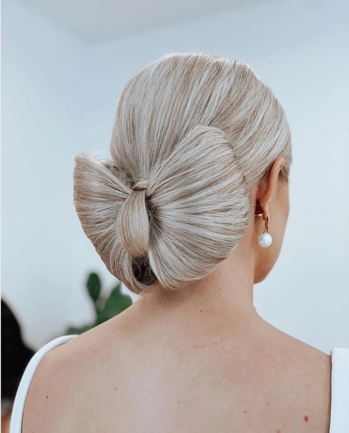 Classic formal black tie wedding hairstyle perfect for an upscale celebration Elegant formal black tie wedding hair styled with sophisticated curls and a polished finish