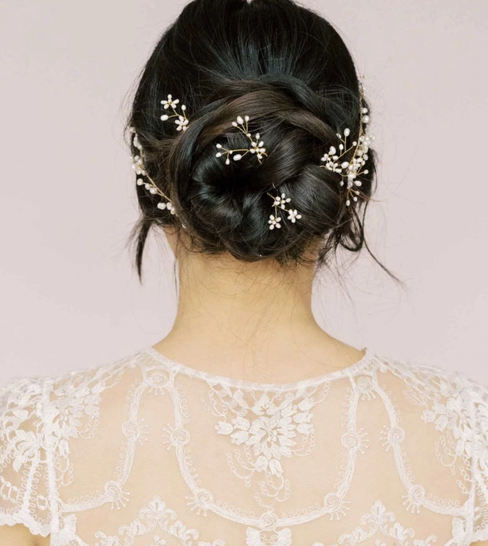 Gothic wedding bridal hairstyle inspiration for a dramatic look Elegant gothic wedding bridal hair styled with dark floral accessories