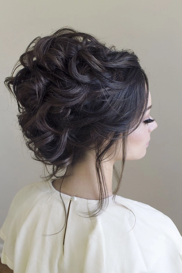 Gothic wedding bridal hair inspiration featuring bold accessories and vintage elegance Elegant gothic wedding bridal hair styled with dark roses and intricate braids