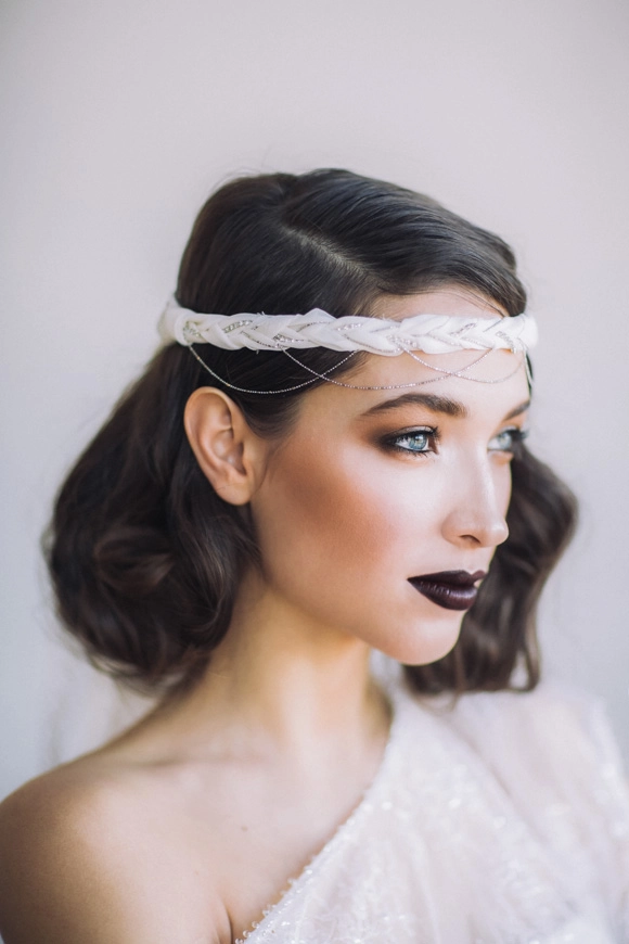 Elegant gothic wedding bridal hairstyle showcasing dramatic curls and vintage-inspired details Gothic wedding bridal hair styled with intricate black lace accessories and dark floral accents