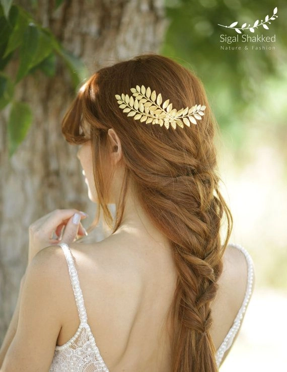 Bride with elegant Greek wedding hair adorned with a delicate olive wreath