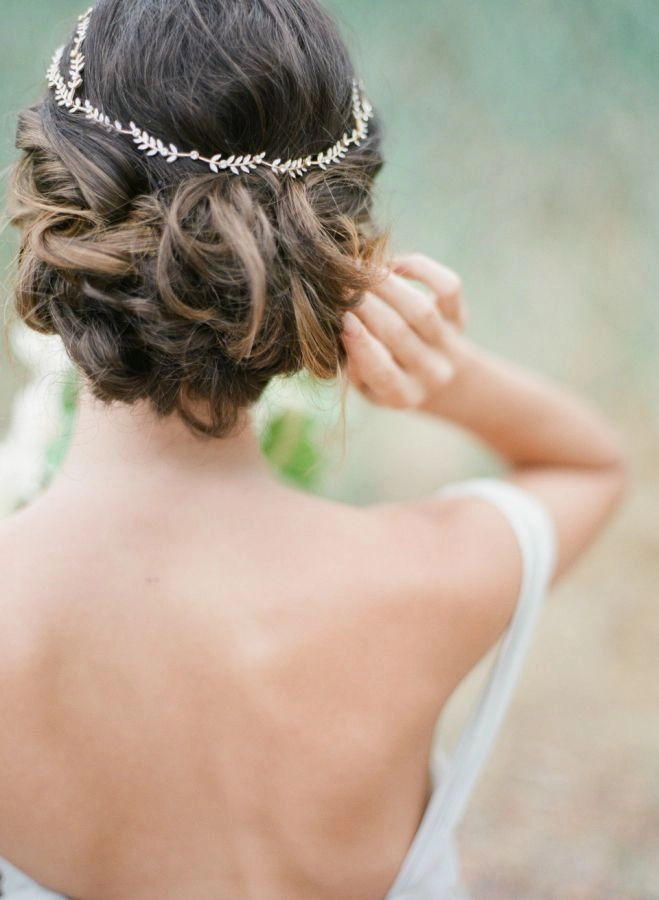 Greek wedding hair styled elegantly with an olive wreath accessory