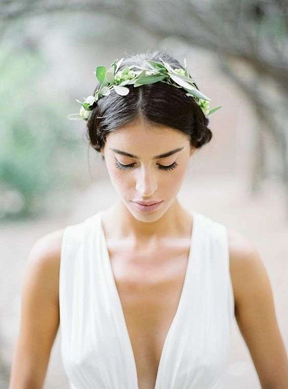 Elegant Greek wedding hair styled with an olive wreath for a natural bridal look