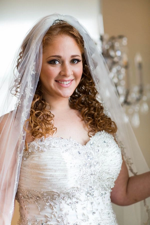 Jewish bride with elegant wedding hair styled under a delicate veil