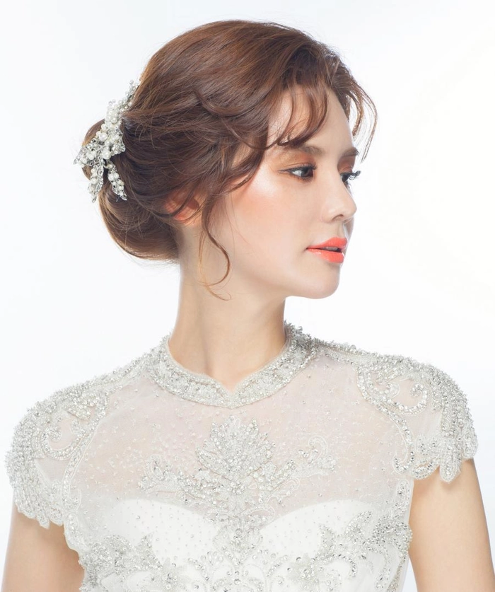 Elegant Korean traditional wedding hair styled with classic accessories