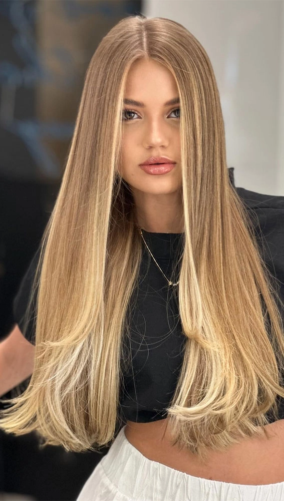 Long straight sleek bridal hair styled for an elegant wedding look
