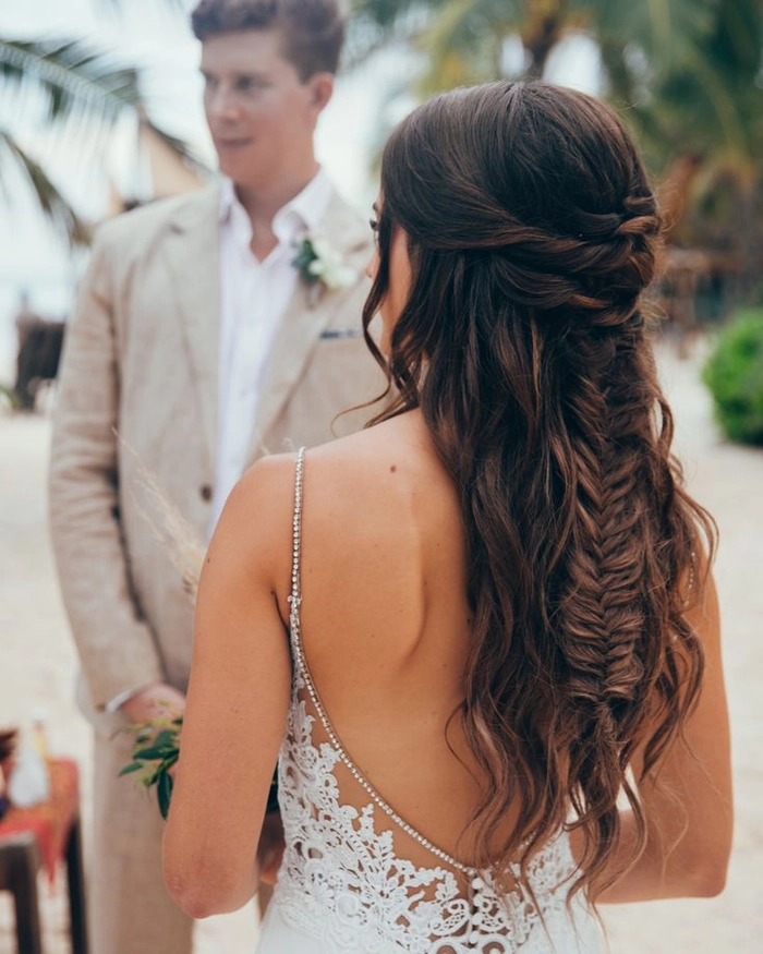 Mexican bridal braided hair styled with intricate floral accents for a wedding