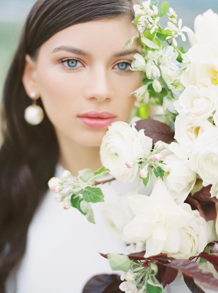 Wedding hairstyles featuring simple and chic bridal hair design number 6 Elegant minimalist bridal hair with delicate floral accents