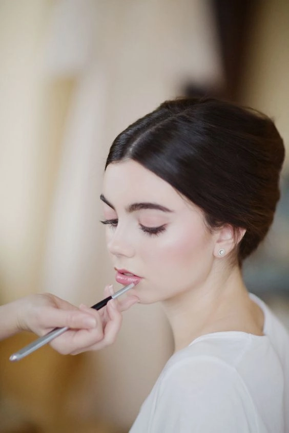 Beautiful minimalist bridal hairstyle perfect for modern weddings Elegant minimalist bridal hair styled with soft waves and delicate accessories