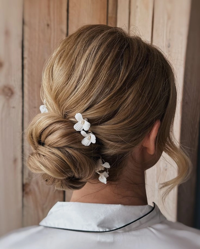 Modern minimalist bridal bun hairstyle perfect for contemporary brides in Wedding Hairstyles category Elegant modern minimalist bridal bun showcasing a sleek, sophisticated wedding hairstyle
