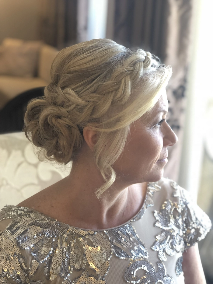 Elegant modern hairstyle ideas for the mother of the groom at weddings Mother of the groom with a sleek, modern hairstyle perfect for weddings