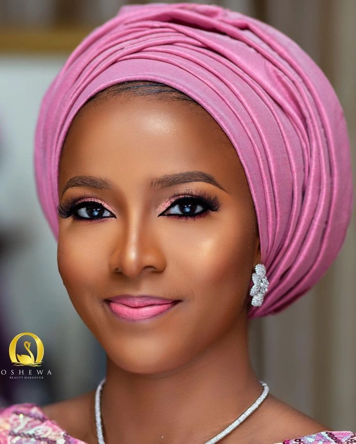 Elegant Nigerian bridal hair gele style showcasing intricate fabric folds and vibrant colors