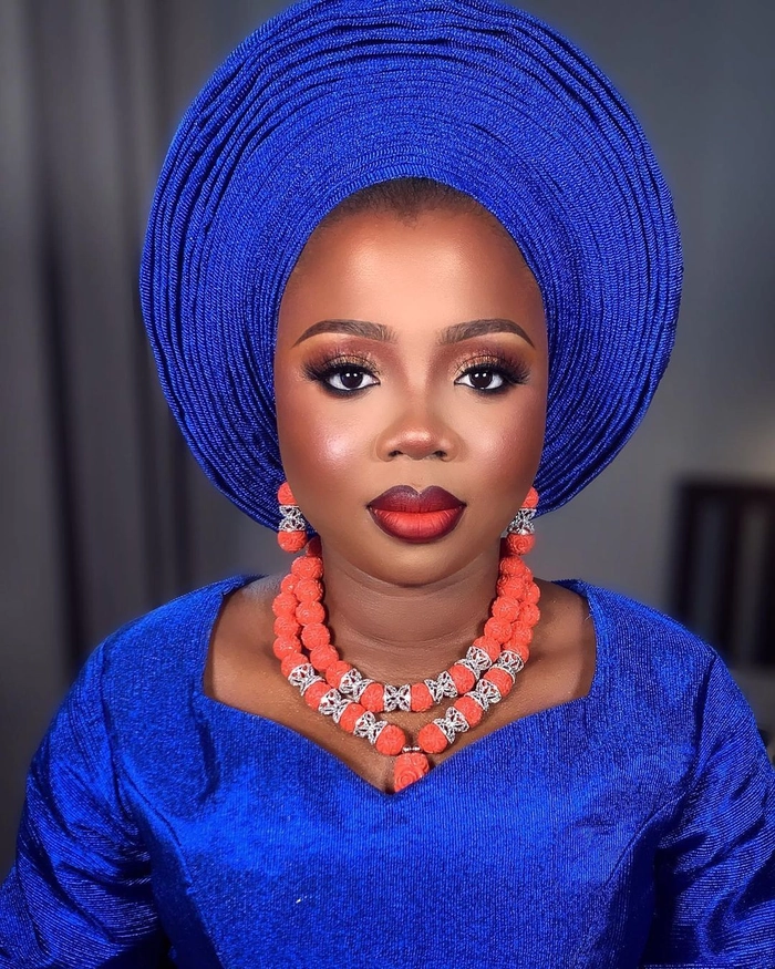Elegant Nigerian bridal gele hair style with intricate folds and vibrant fabric