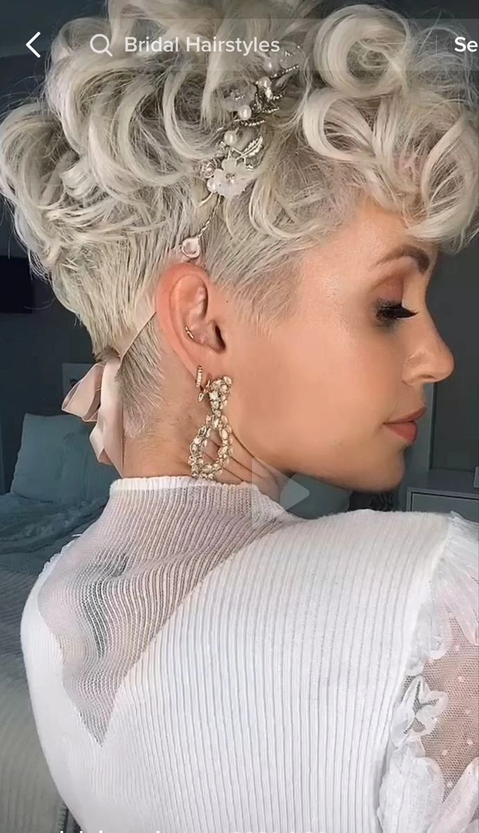 Chic pixie cut styled with bridal hair accessories perfect for weddings Pixie cut with elegant wedding hair accessories featuring delicate floral accents