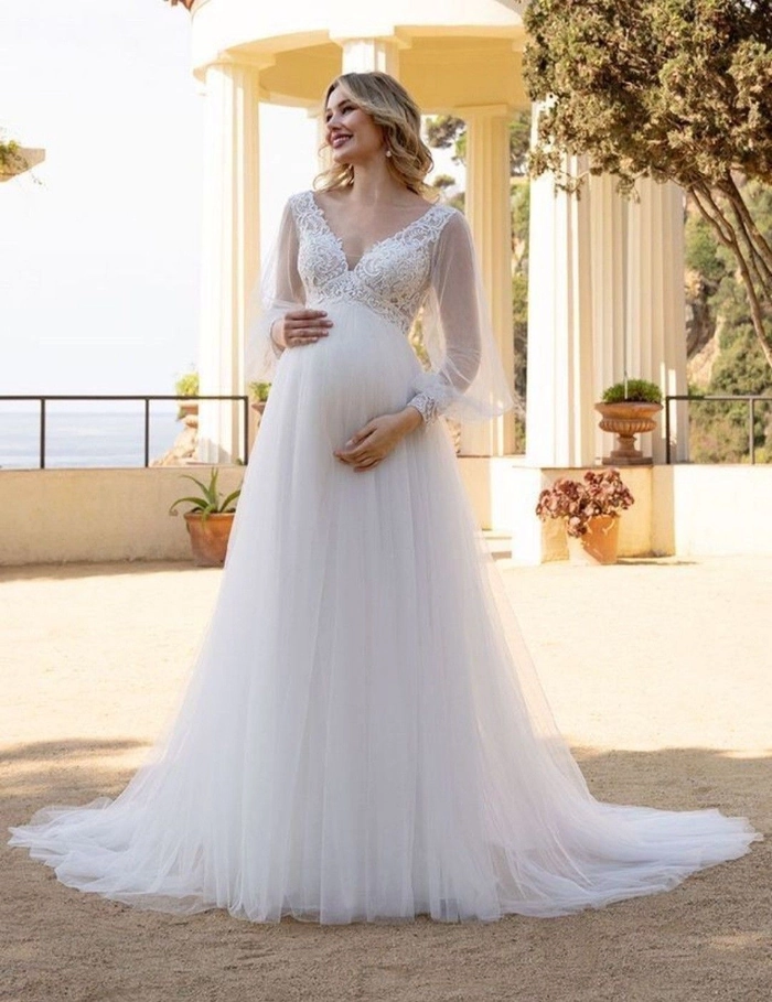 Elegant wedding hair for a glowing pregnant bride on her special day Pregnant bride with a comfortable and elegant wedding hairstyle