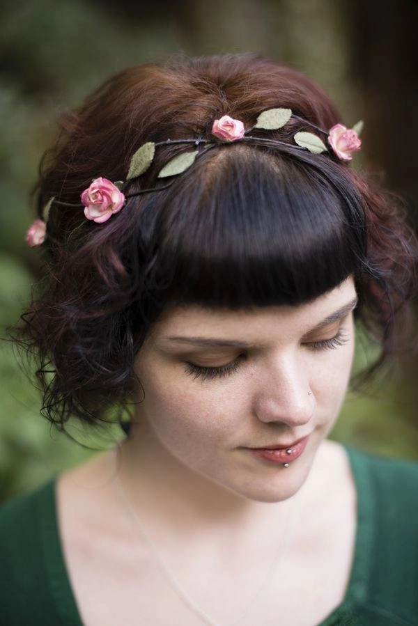 Romantic bridal hairstyle inspired by renaissance fair traditions Elegant renaissance fair wedding hair featuring braided floral accents