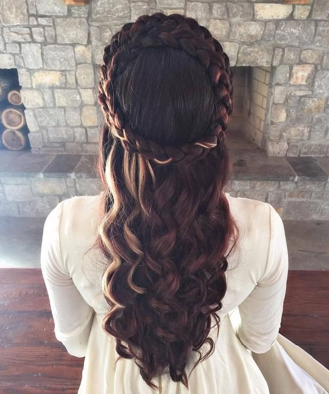 Elegant wedding hairstyle inspired by renaissance fair themes perfect for brides Renaissance fair wedding hair with intricate braids and floral accents