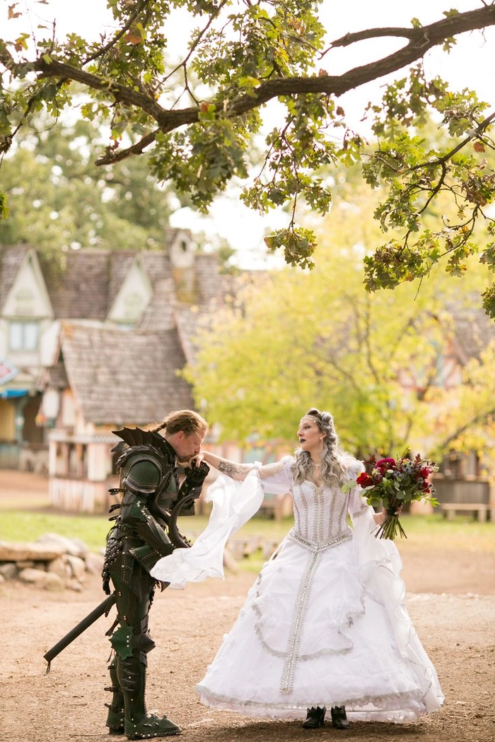 Romantic bridal hairstyle inspired by renaissance fair fashion for weddings Elegant renaissance fair wedding hair styled with intricate braids and flowers