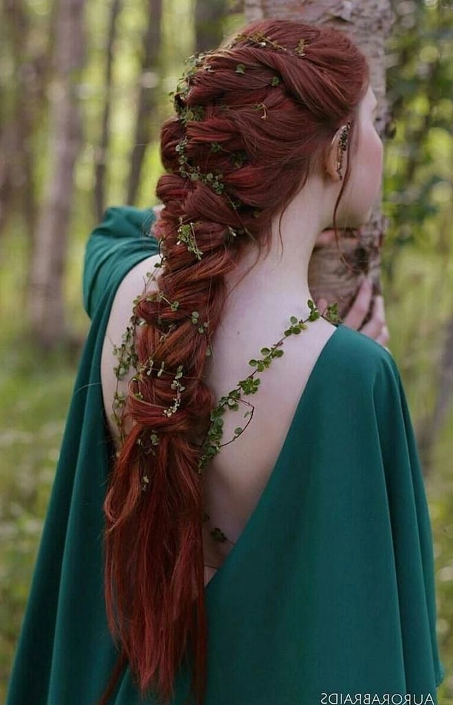 Romantic bridal hairstyle inspired by renaissance fair traditions for weddings Elegant renaissance fair wedding hair adorned with delicate floral accents