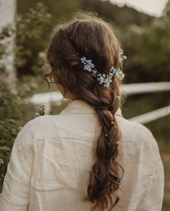 Soft romantic cottagecore wedding hair styles with floral accents