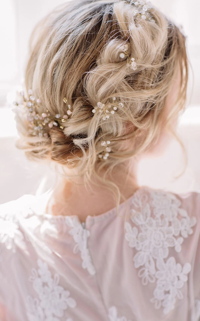 Elegant outdoor rustic wedding bridal hair with soft curls and floral accents