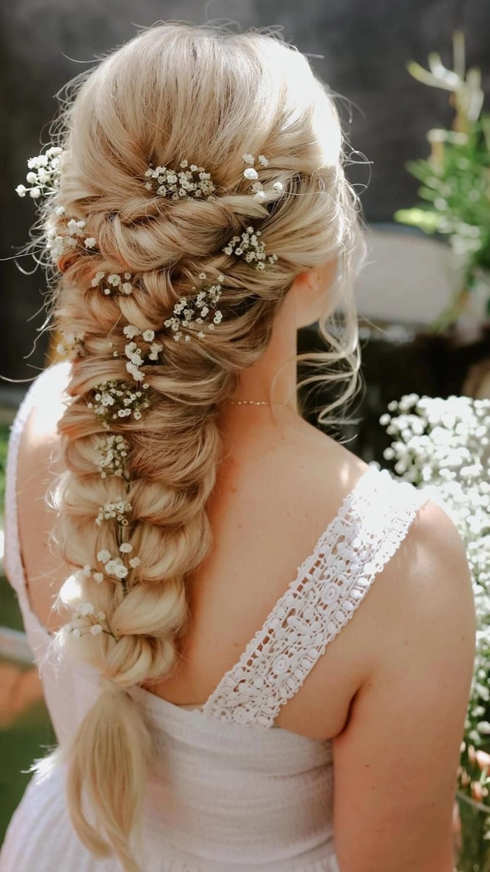 Chic and romantic bridal hairstyle ideas for a second wedding celebration Elegant second wedding bridal hair styles with soft curls and floral accents