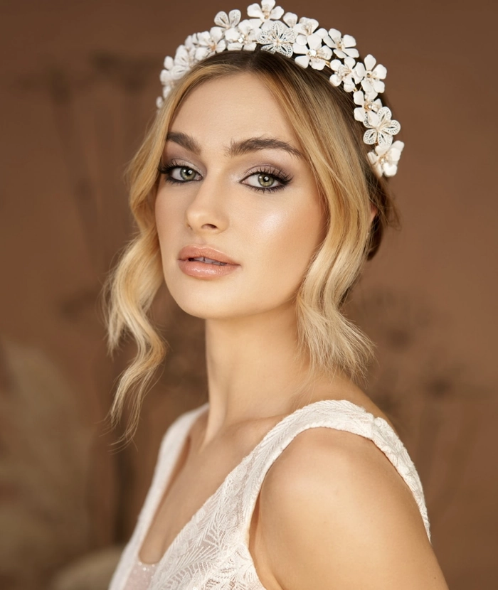 Chic and timeless bridal hair design perfect for a second wedding celebration Elegant second wedding bridal hair styles featuring soft curls and floral accents