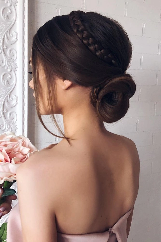 Chic and stylish short hair bridesmaid updo for a wedding celebration Short hair bridesmaid updo with elegant curls and floral accents