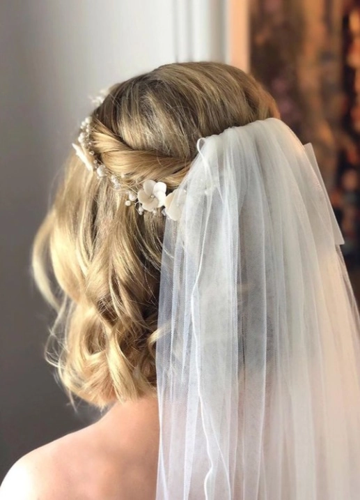 Elegant short wedding hair with extensions showcasing a bridal look Short wedding hair styled elegantly with extensions for added volume